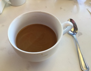 The cup dwarfed the spoon